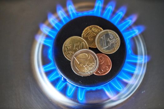 Natural gas price, top down view of gas stove. Methane gas prices