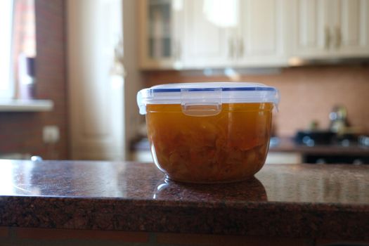 Plastic container with freshly prepared soup, food to go