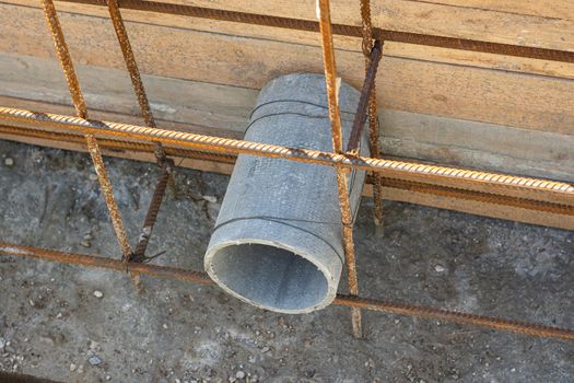 Construction of a strip foundation, laying a sleeve for communications