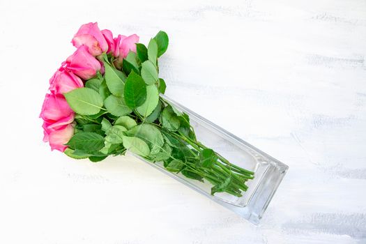 Pink Rose Bouquet in Glass Vase on White Table