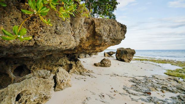Beautiful wild tropical beach near Anda with granite rocks. Bohol Island. Philippines.