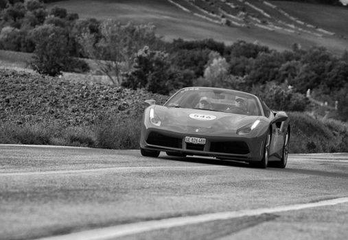 FERRARI 488 SPIDER on an old racing car in rally Mille Miglia