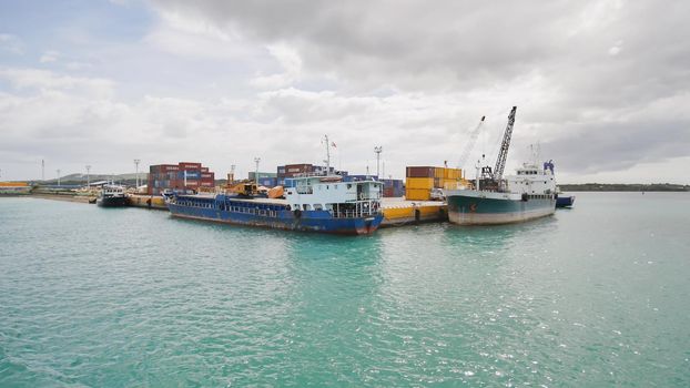 Tagbilaran, Philippines - January 5, 2018: Commodity containers and ships in the port of Taagbilaran. Philippines.