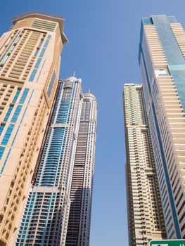 High-rise skyscrapers with blue sky of Dubai city. UAE.