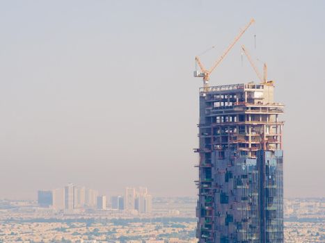 Construction of a tall skyscraper in Dubai.