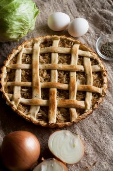 Traditional rustic vegetarian pie with cabbage and onions