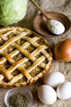 Traditional rustic vegetarian pie with cabbage and onions