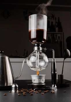 Syphon alternative method of making coffee. coffeemaker is a manual pour-over style glass. Cofee brewing.