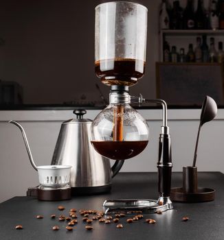 Syphon alternative method of making coffee. coffeemaker is a manual pour-over style glass. Cofee brewing.
