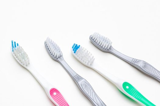 Flat lay composition with manual toothbrushes on color background, close up