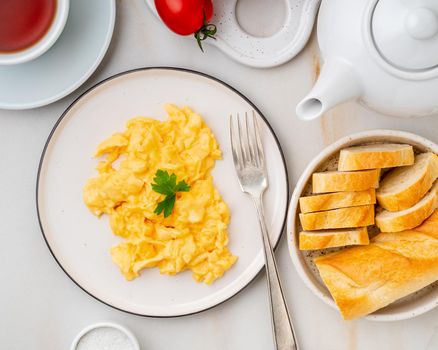 Scrambled eggs, Omelette. Breakfast with pan-fried eggs