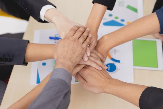 Closeup topview businesspeople join hand together.Stack of people hands. Unity and Team Teamwork Empower business worker for company concept.
