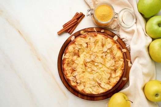 Cheesecake, apple pie, curd dessert with polenta, apples, almond flakes