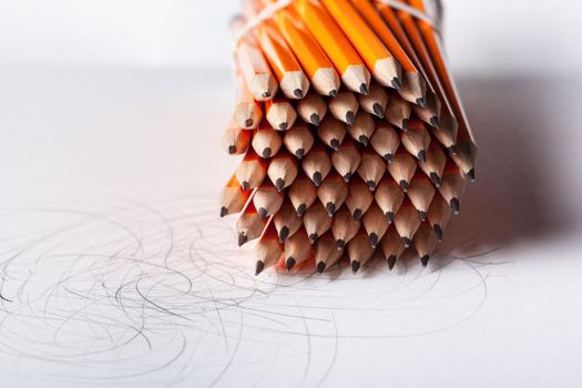 Arrangement of orange pencils close up. Creative Photo