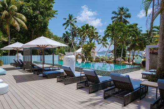 Praslin Seychelles April 2022, luxury resort at the beach of Anse Volbert tropical island with withe beaches and palm trees,