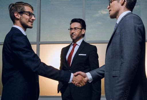 business partners shake hands