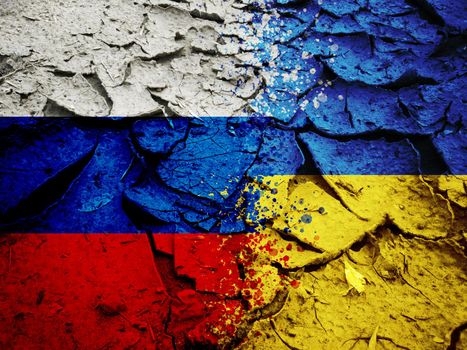 Russia vs Ukraine national flags on dry cracking earth