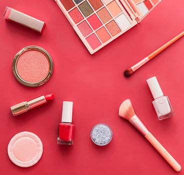 Beauty, make-up and cosmetics flatlay design with copyspace, cosmetic products and makeup tools on coral background, girly and feminine style