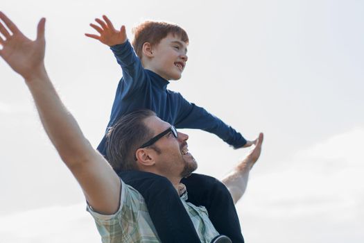 young father and son have fun and fly.photo with copy space