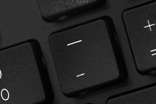 Black laptop keyboard close up. Macro photo.