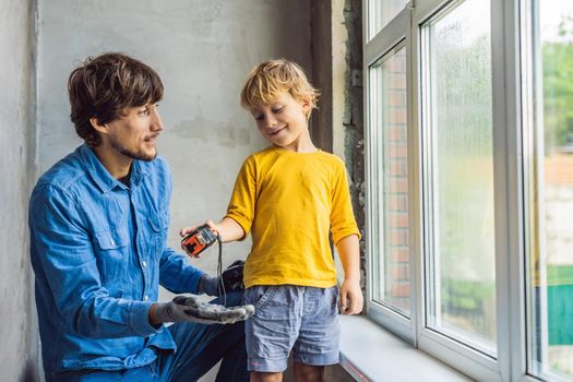 Father and son repair windows together. Repair the house yourself