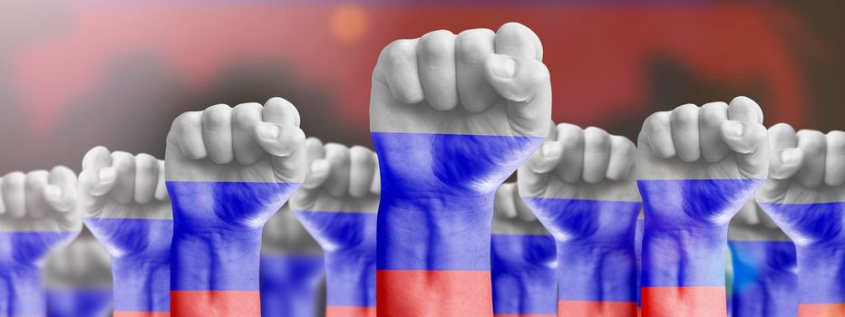 Raised fists against the background of the national flag of Russia. The concept of a revolution. Protests against the government, struggle for democracy and freedom.