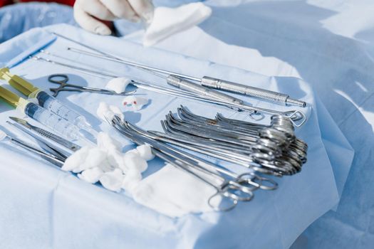 Surgical stainless equipment on the sterille table in operation room.