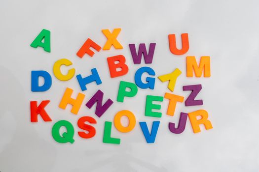 Alphabet letters in a random order on a white background