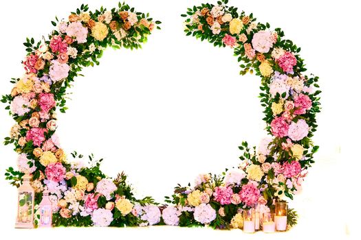 Large floral multi colored wreath with candles for the holiday