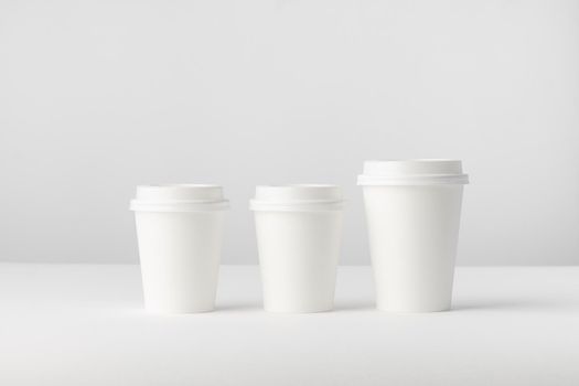 Three white paper Coffee Cups