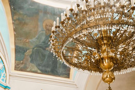 Big chandelier in the church. Church interior. Orthodox faith. Equipment for praying. Pray for people life. Pray to god.