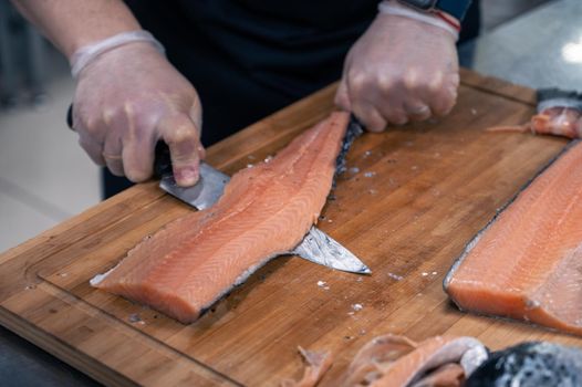 Chef preparing a salmon fish
