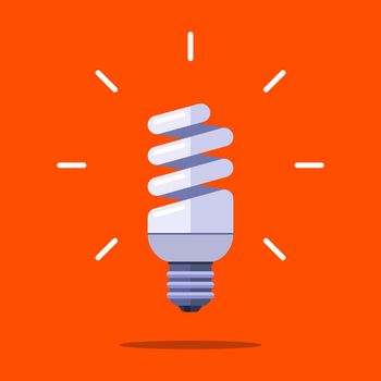 energy saving lamp in the form of a spiral on an orange background.