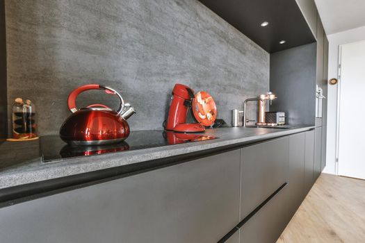The interior of a small kitchen in black and minimalist style