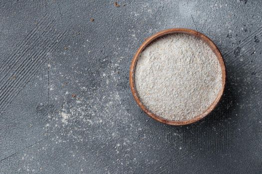 Rye flour in a wooden bowl top view