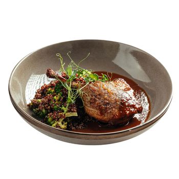 Isolated portion of confit duck leg
