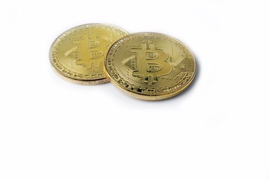 Two bitcoins - gold isolated on white background