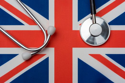 UK flag and stethoscope. The concept of medicine.