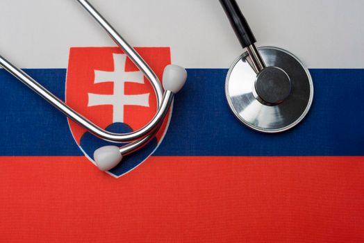 Slovakia flag and stethoscope. The concept of medicine.