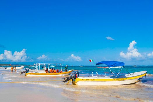 Waves boats caribbean coast and beach panorama view Tulum Mexico.