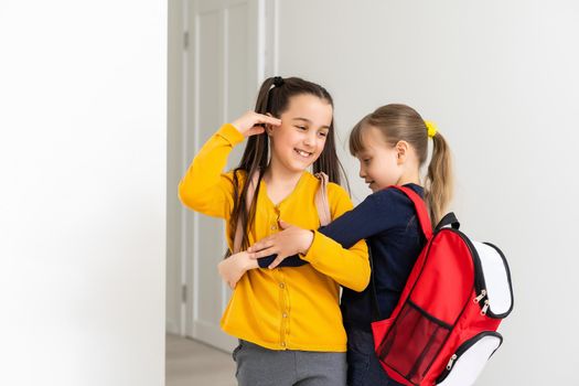 Kids going to school schoolgirls with backpacks, fancy girls concept