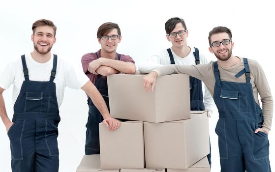 Men holding pile of carton boxes isolated on white background