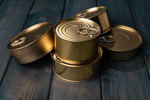 Closed food tin cans on dark background