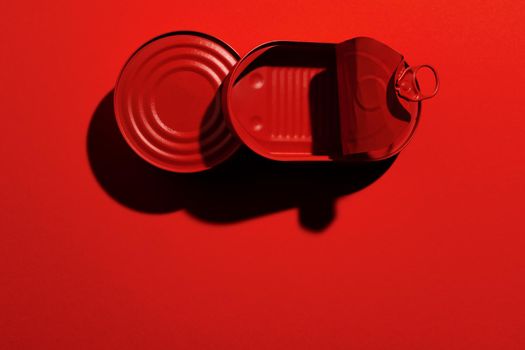 Dark red tin can on red background