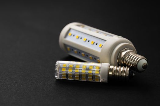 Compact light bulb isolated on black background