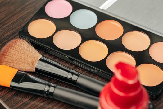 Make up products on vanity table close up