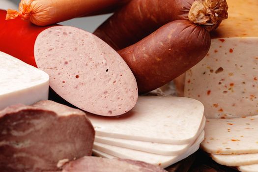Variety of meat and sausage products on table