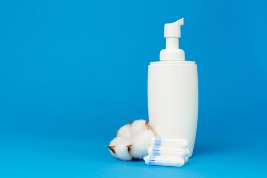 Female medical tampons and shower gel bottle