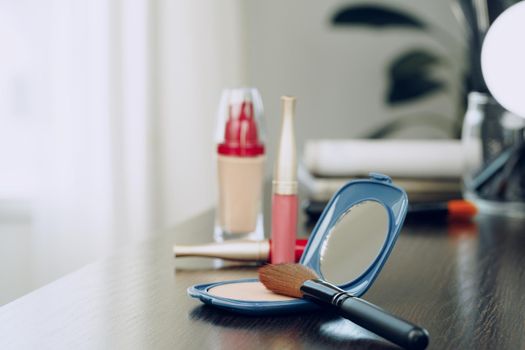 Make up products on vanity table close up