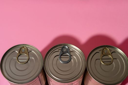 Canned food tin on pink studio background